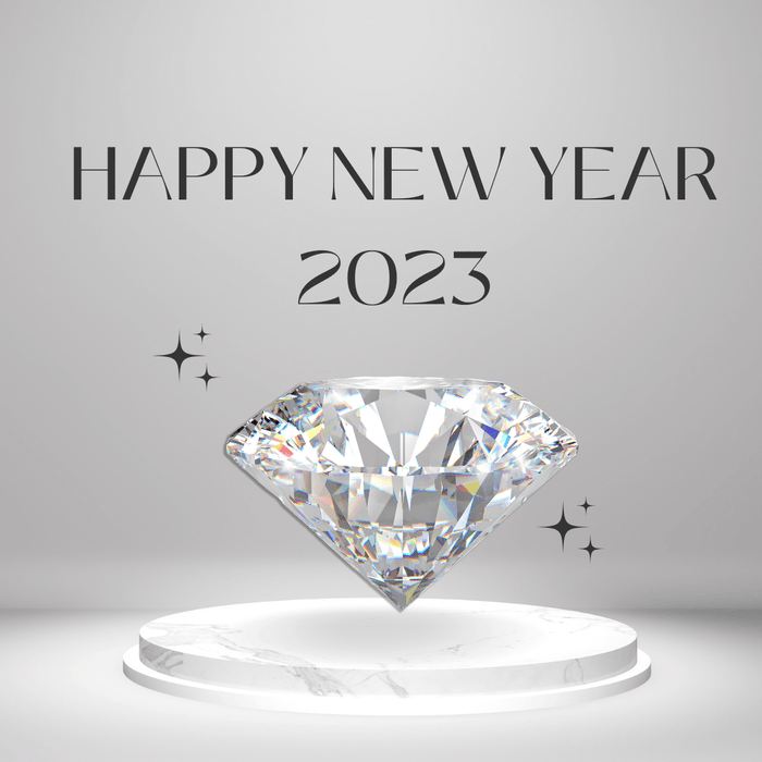 HAPPY NEW YEAR 2023の文字と台座に置かれた輝く宝石のイラスト